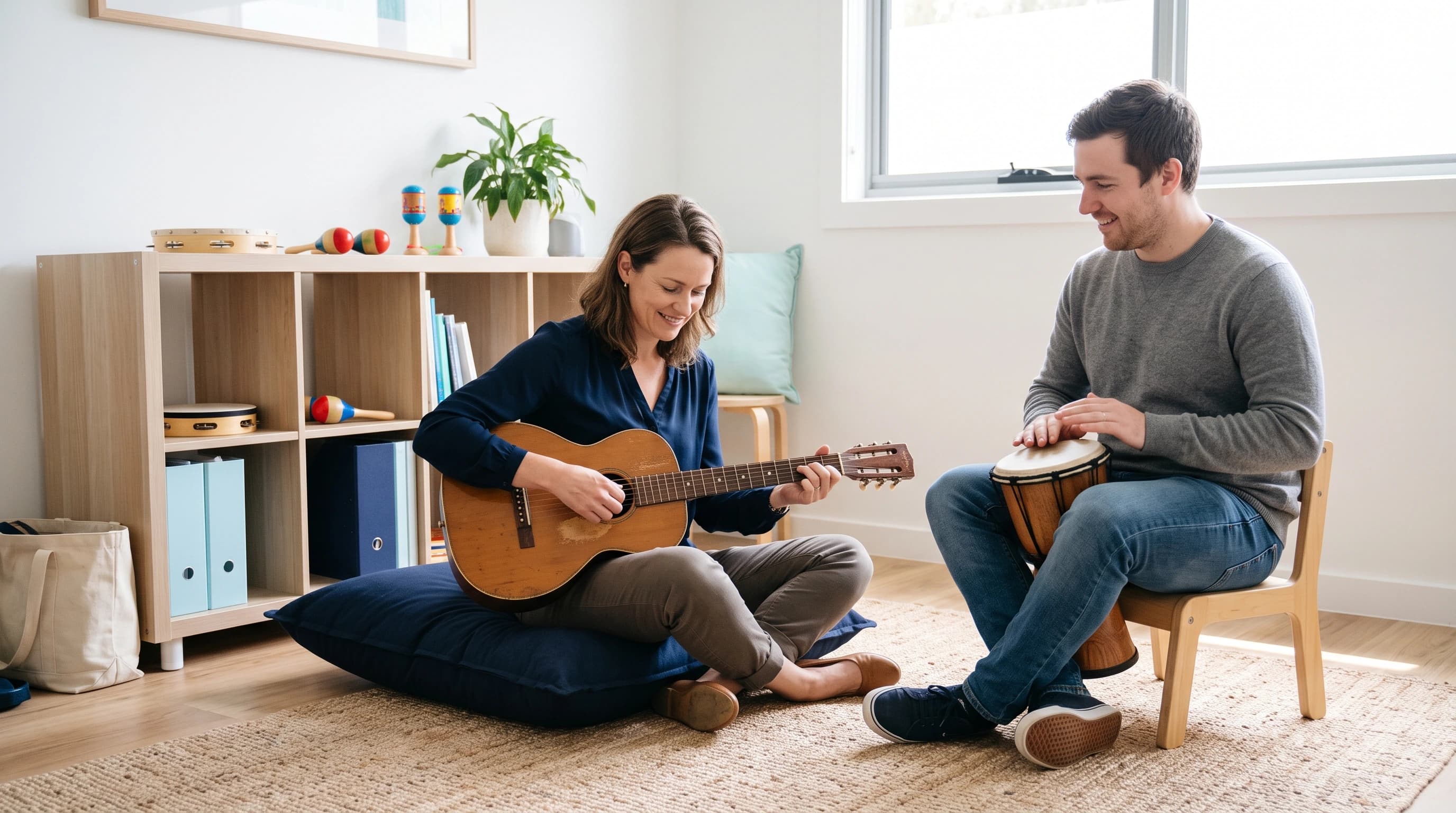 Photo of a music therapist playing an instrument with a client in a bright therapy room
